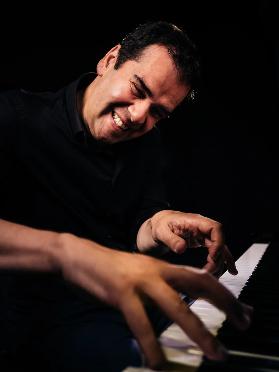 Composer Ruben Alves playing the piano